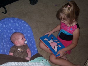 Audrey reads to Tyler every day. She's a great big sister.